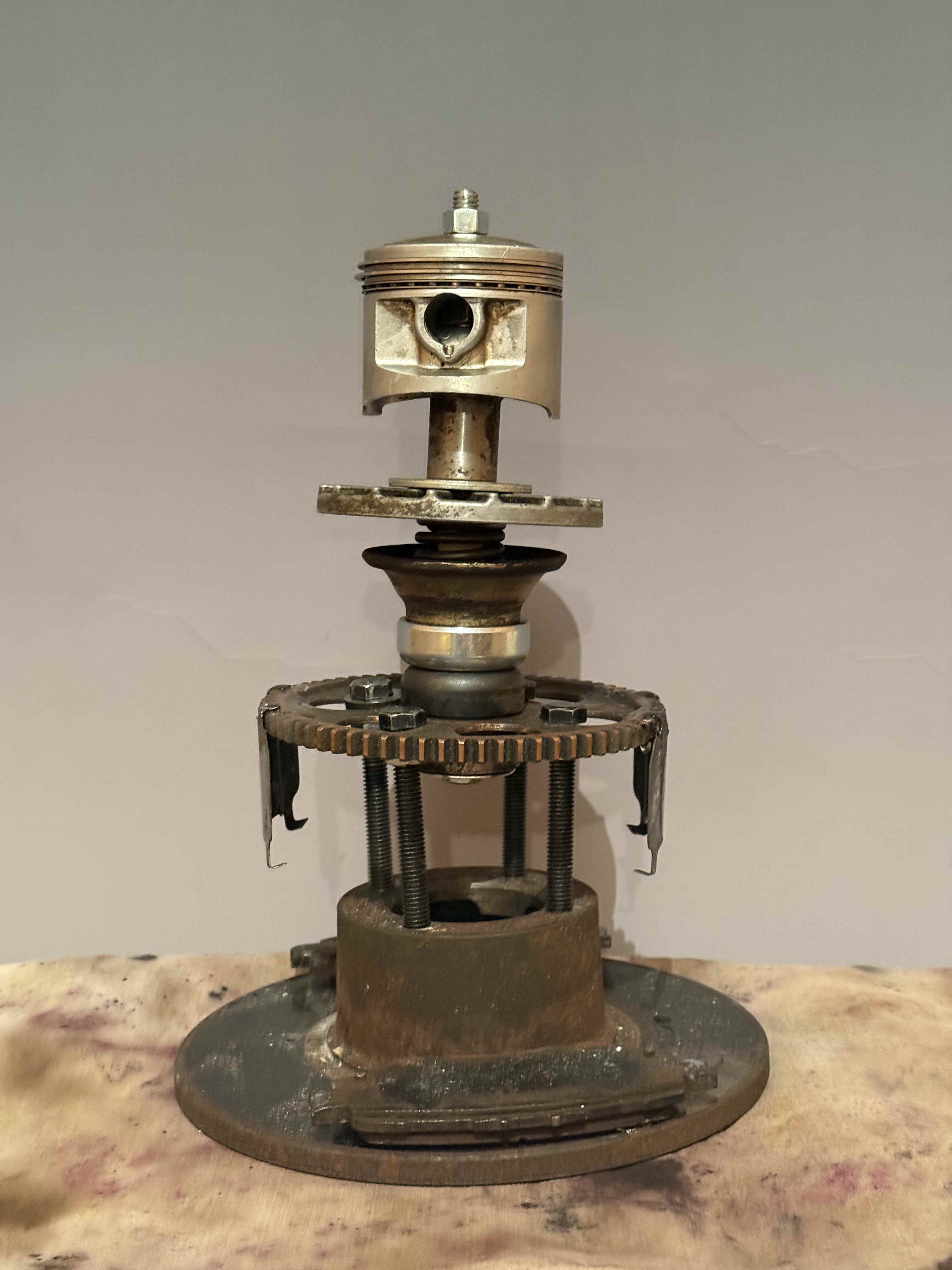 a trophy made of repurposed engine parts