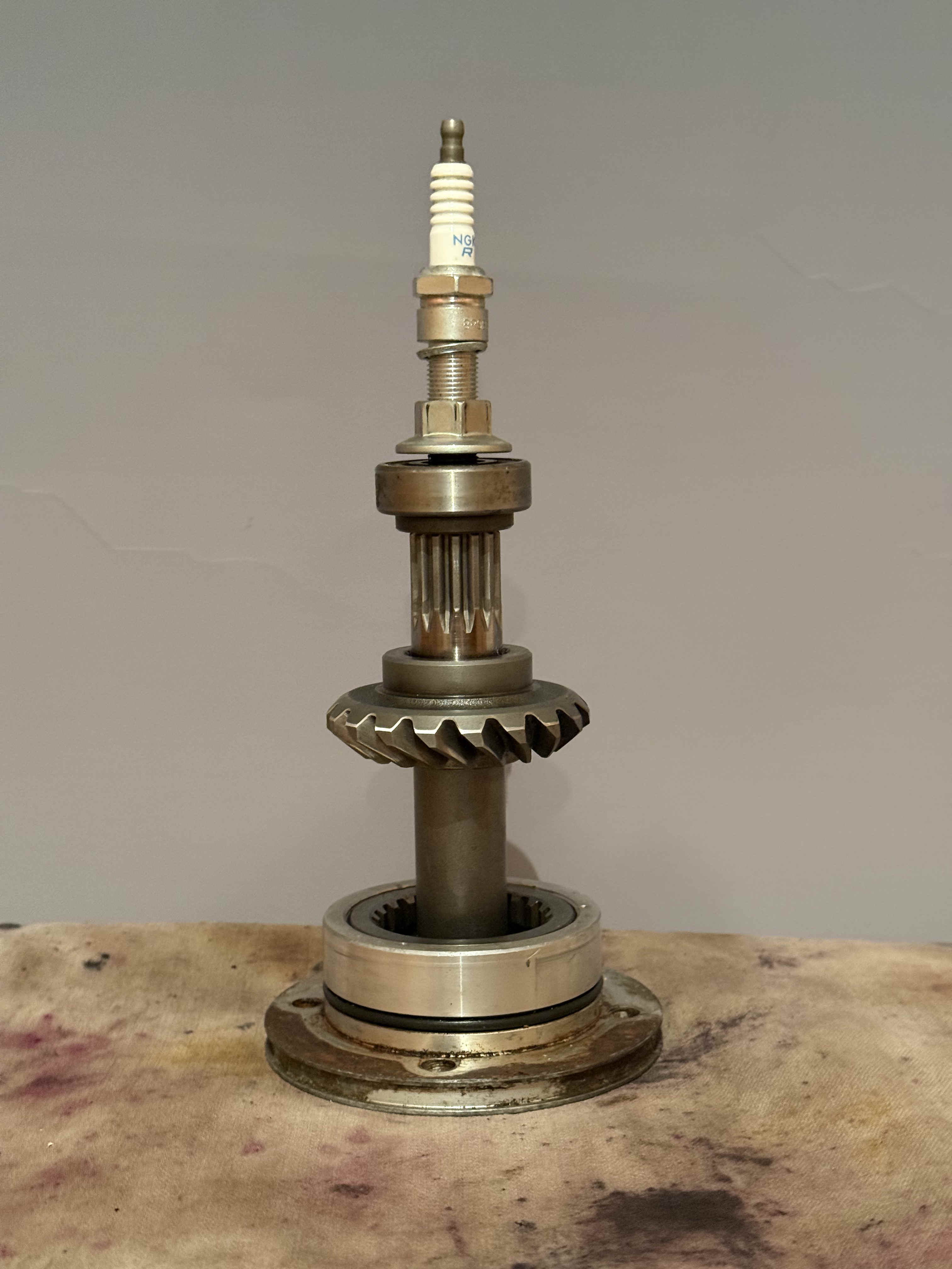 a trophy made of repurposed engine parts